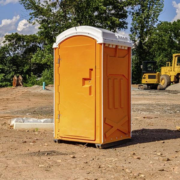 what is the cost difference between standard and deluxe portable toilet rentals in East Bradford